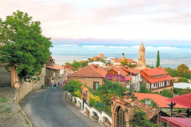 Evening view of the streets of Sighnaghi and the views of the Alazani Valley opening in th