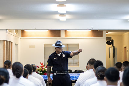 A drill sergeant commands the attention of academy recruits, delivering orders with precis