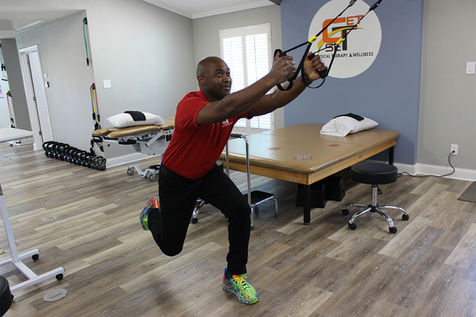 Dr. Howie Barrett demonstrating a physical therapy exercise.