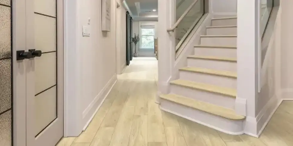Residential hallway with vinyl planks mimicking light-colored wood. Curated Grain Floor in Pickle by Karastan