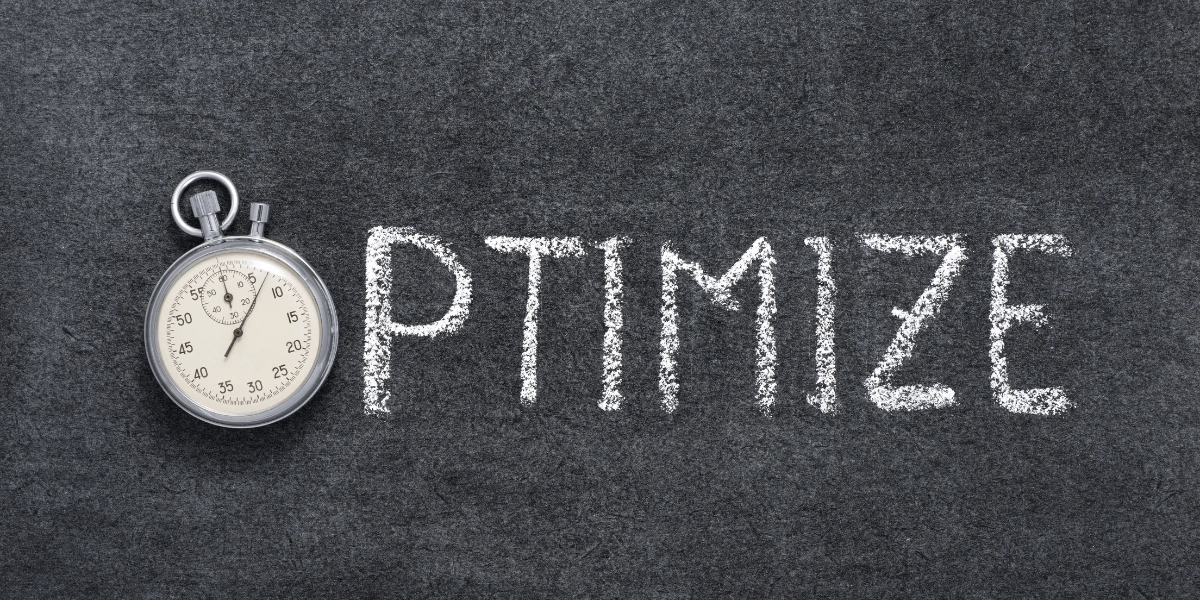 The word 'OPTIMIZE' written on a chalkboard but with a stopwatch replacing the letter O