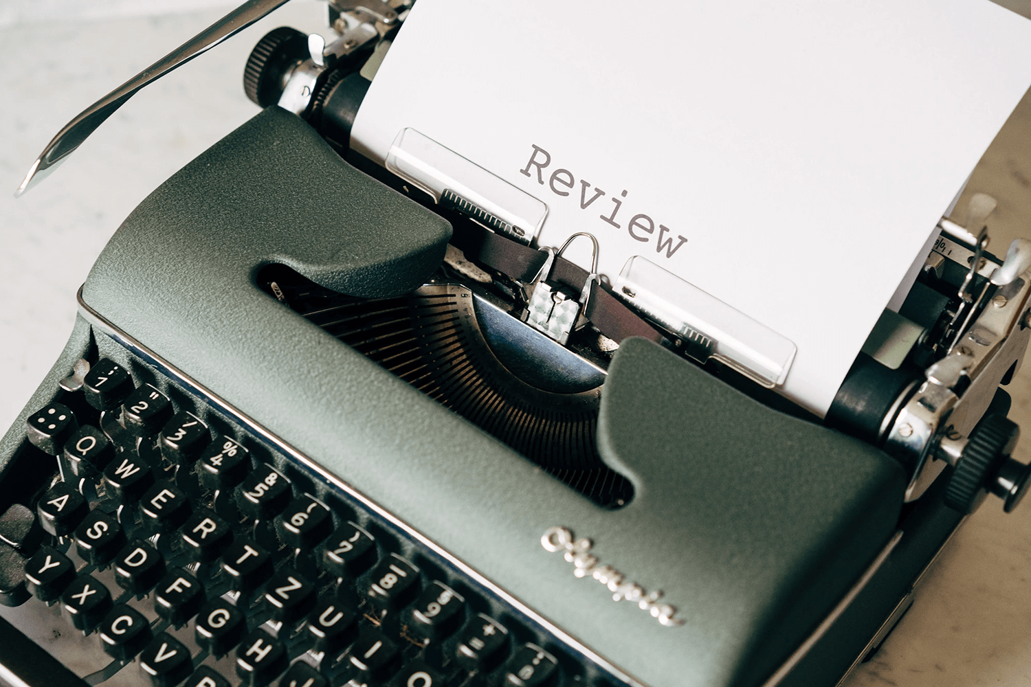 A typewriter showing review