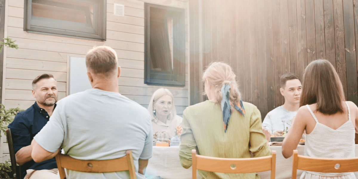 Backyard used as a place for entertaining friends or family, seen here eating together