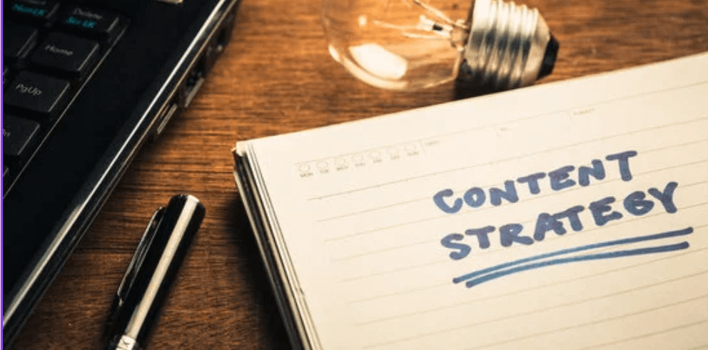 An open notebook with 'Content Strategy' written on it