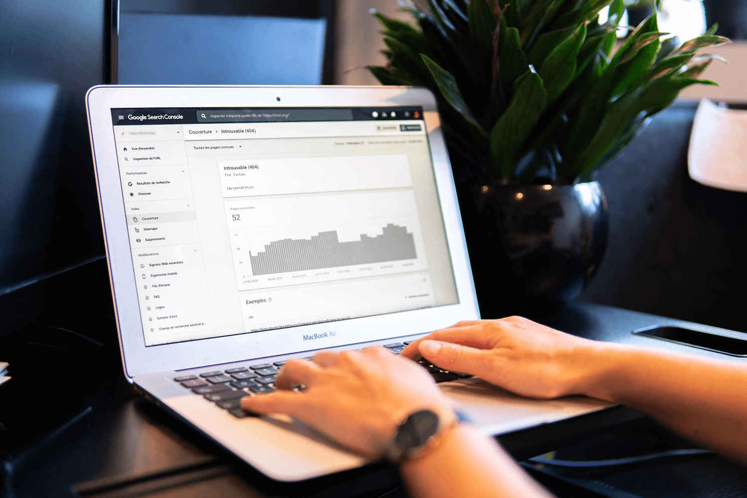 Hands on keyboard of a laptop showing stats for local SEO