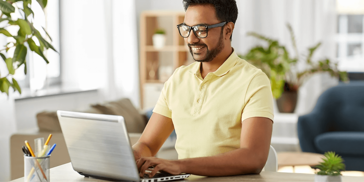 A smiling man finding a site with the power of SEO and SEM