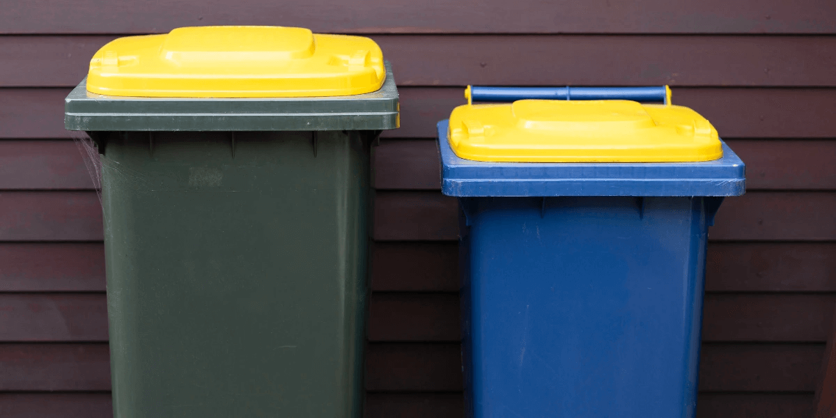 two closed garbage bins to keep rats away