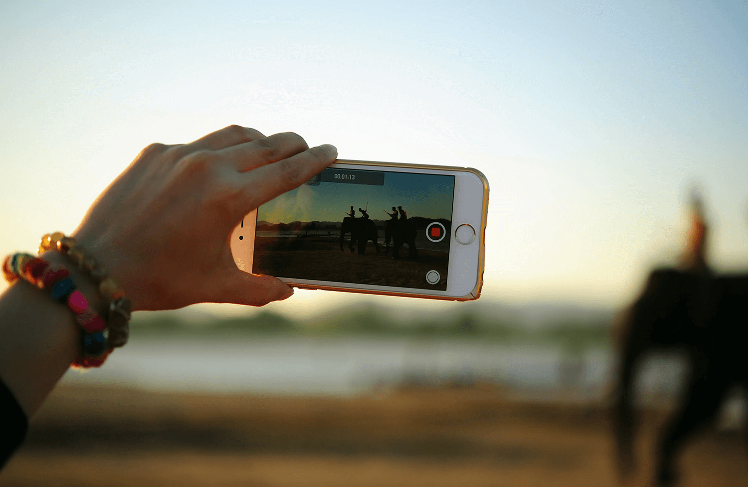 A person using a smartphone to record a video