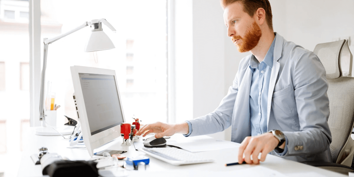 A person researching keywords on a laptop 