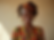 A vibrant-medium shot of a graceful woman adorned in richly patterned African print clothi