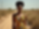 A stylish woman confidently wearing a modern African print dress with clean lines and vibr