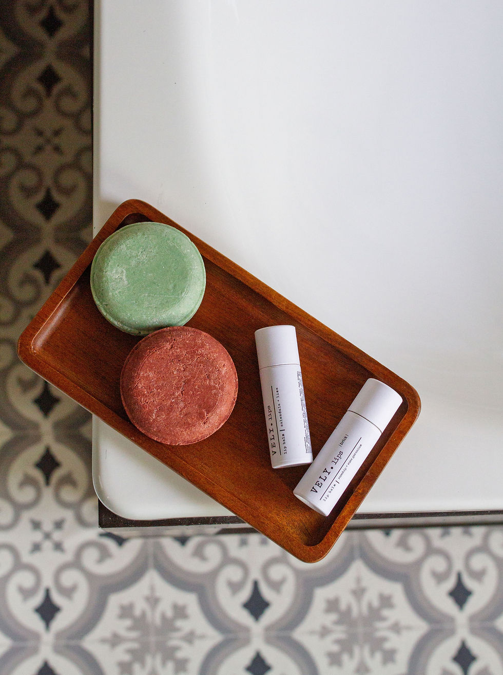Thumbnail: shampoo bars and lip balms on wooden tray