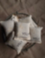 embroidered lavender sachets in a wired basket the vely soapery
