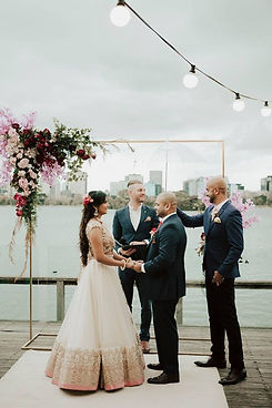 Priyanka and Dan with their Melbourne wedding celebrant, Benn Stone, enjoying a stress-free and fun day. The couple shares their gratitude for Benn's exceptional work as their celebrant, MC, and DJ, highlighting how relaxed and well-spoken he made the ceremony. They appreciate how Benn coordinated the key elements of their wedding, making everything enjoyable and seamless. Friends even inquired about hiring him as their celebrant. Benn's friendly, professional, and humorous approach made their day unforgettable. Highly recommend Benn for couples seeking a top-notch wedding celebrant in Melbourne.