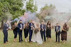 Hailey and Josh with Benn Stone, their Melbourne cityside celebrant, celebrating their perfect wedding day. The couple praises Benn for his sweet and fun personality, tailoring the ceremony to suit them perfectly. They highlight his exceptional work as their celebrant, MC, DJ, and photo booth provider, calling him the ultimate wedding package. They highly recommend Benn as a top wedding celebrant in Melbourne, confident that others will be just as thrilled.
