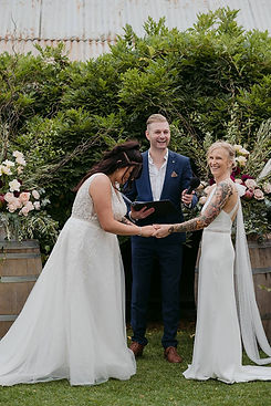 Steph and Izzy with Benn Stone, their Melbourne cityside celebrant, after their personalized and fun wedding ceremony. The couple thanks Benn for his exceptional work as their celebrant, MC, and DJ, making their day stress-free and enjoyable. They highlight how Benn’s custom ceremony made the day feel truly personal, and his reliability and relaxed approach ensured everything ran smoothly, proving him to be an outstanding wedding celebrant in Melbourne.