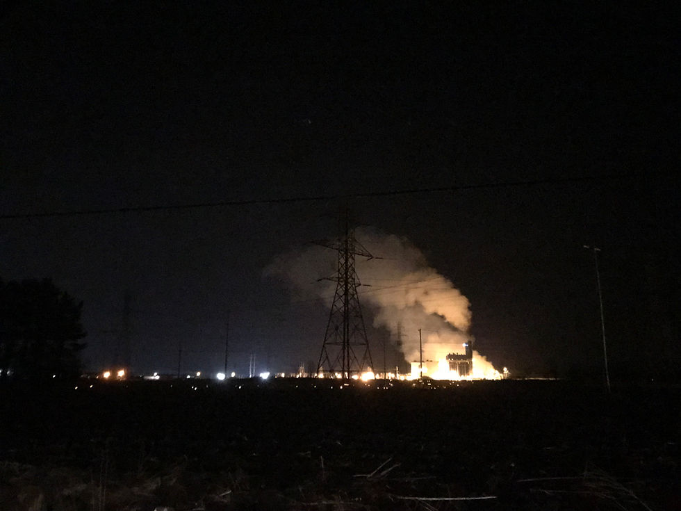 Unshielded light reflects off vapor cloud above an industrial site near New Carlisle, IN, giving a bright concentrated glow. The same thing is happening with particulates in clouds higher up--the stray light is reflecting back down.