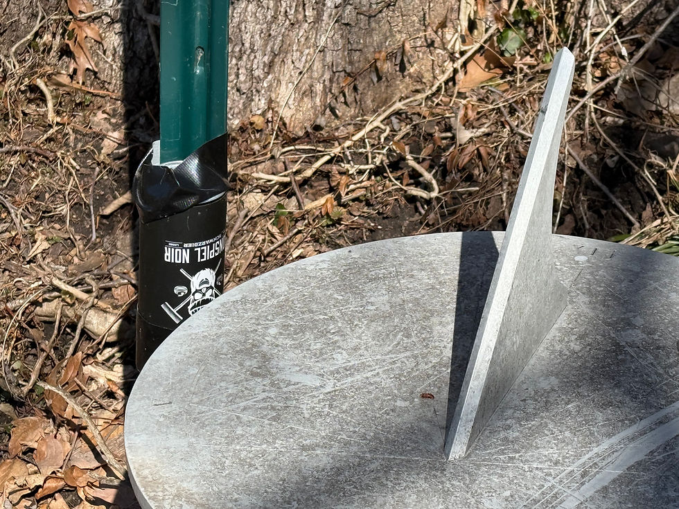 The pinhole (the camera's aperture) is nearly level with the sundial and pointed toward the gnomon. March 9, 2025 at 12:26 PM