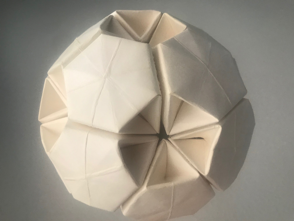 Spherical model made from paper plates by Non Techathuvanun.