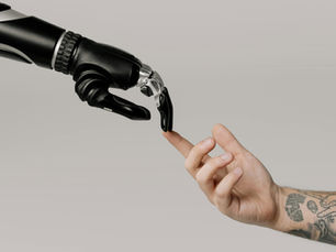 Human and robot touching fingers