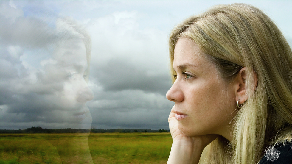 woman reflecting on career and identity, quiet leadership coaching