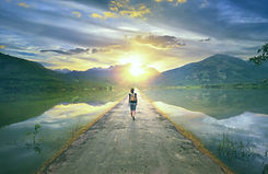 Traveler walking along the road to the mountains._edited.jpg