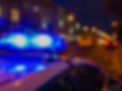 Unrecognizable blurry police car lights on night street background, crime scene, night pat