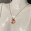 Thumbnail: Enameled Heart Necklace on mannequin