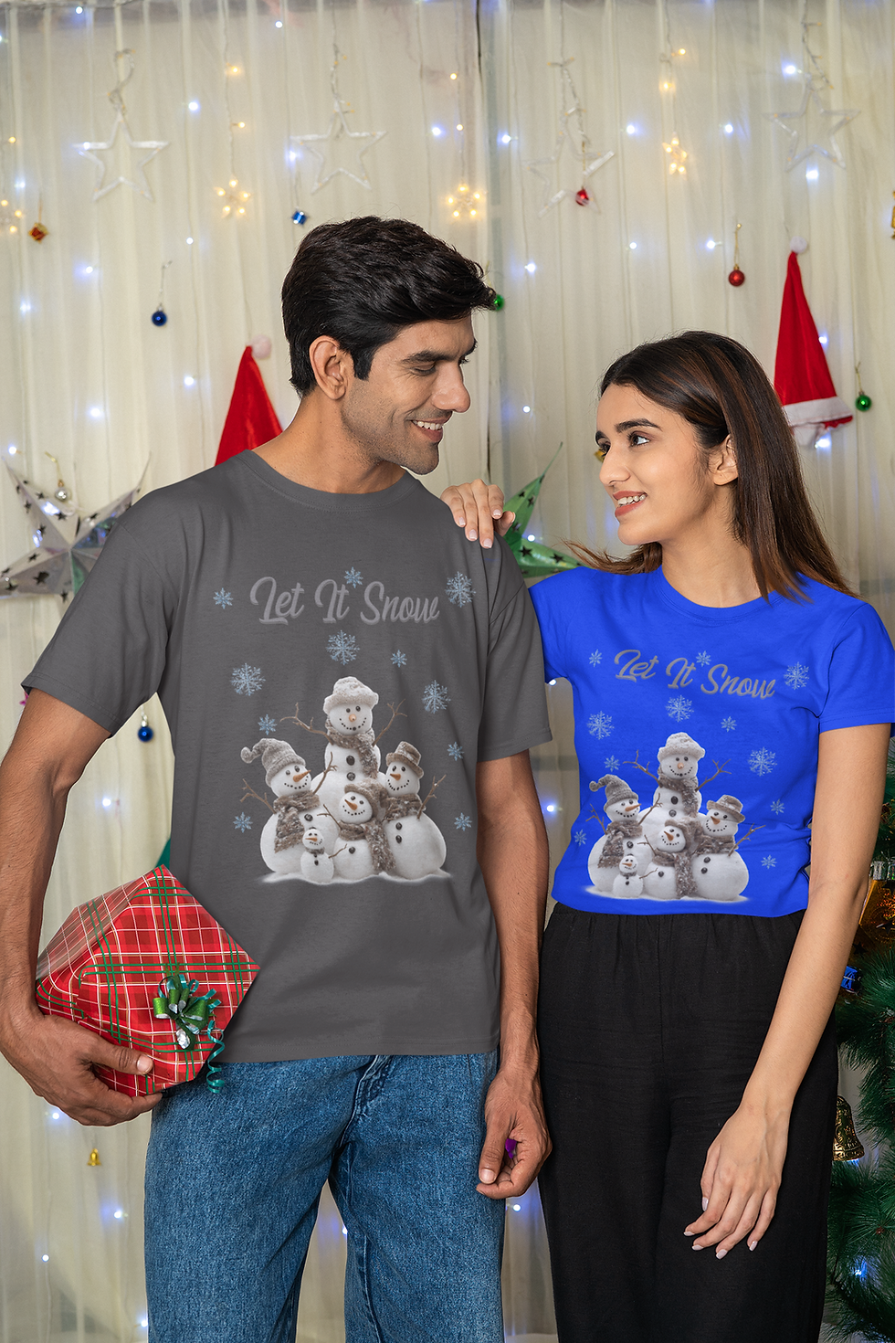 Model couple wearing Let It Snow Christmas T-shirt in gray