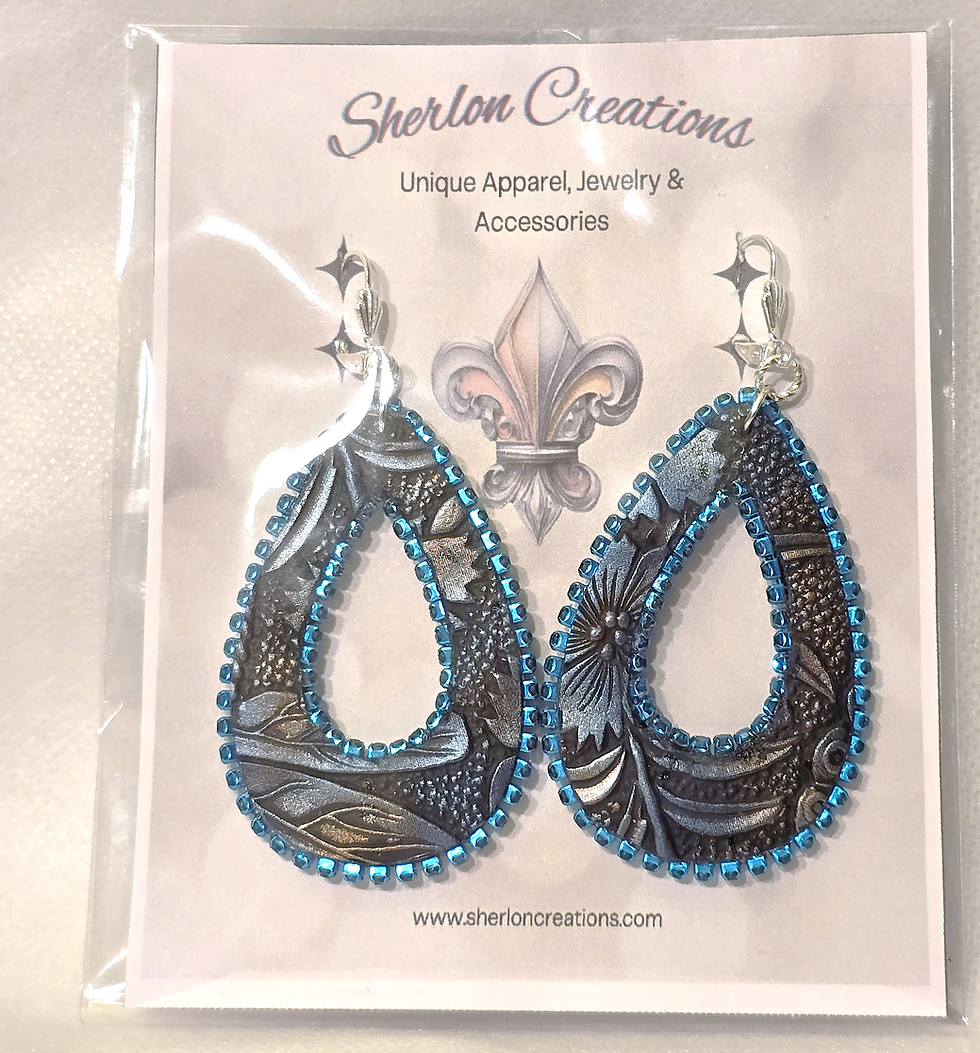 Thumbnail: Dragonfly Leather Teardrop Earrings in packaging