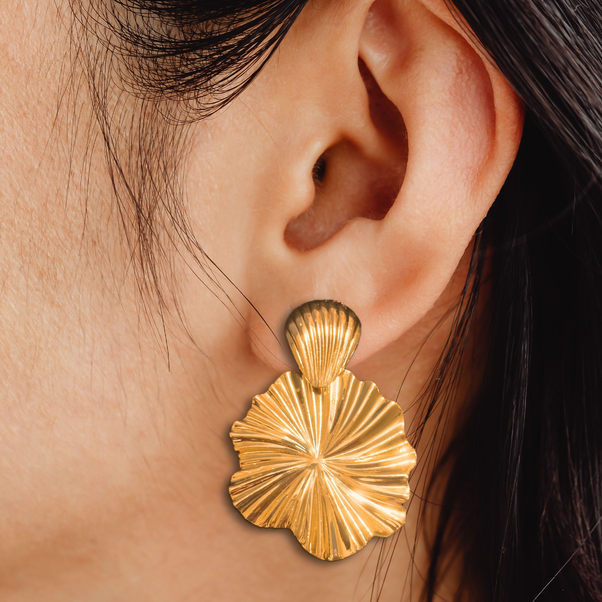 Model wearing the Gold Swirl Earrings