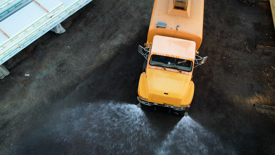 Water spray down to prep the ground for treatment.png