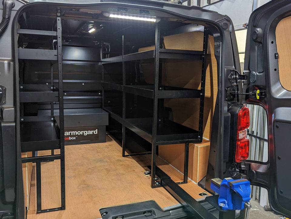 Sliding vice beam fitted with internal metal van racking and armorgard storage box