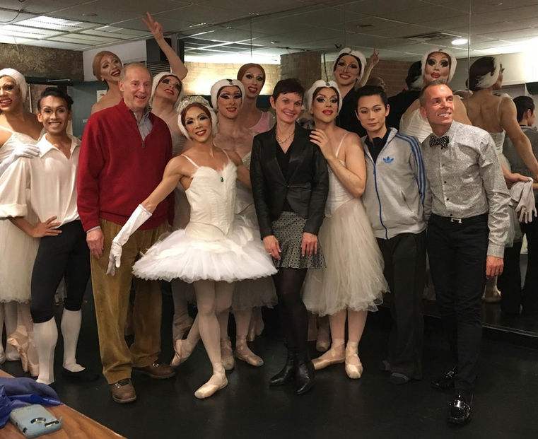 Ballet dancers cluster backstage; Denise is a central flgure