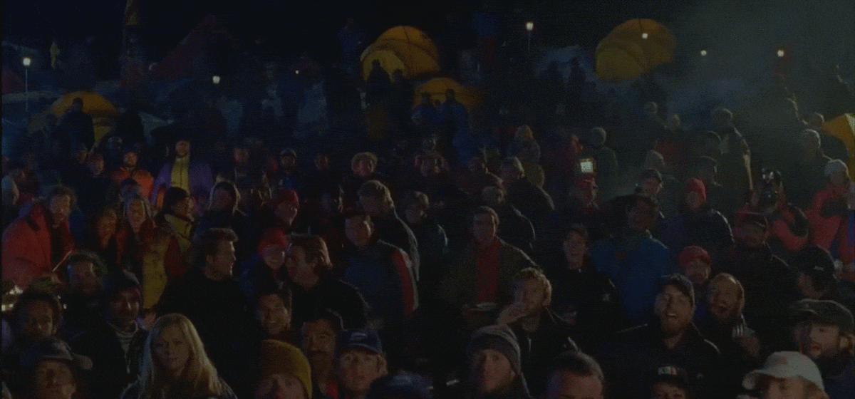 A crowd cheering heckler