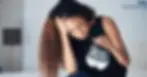 a woman is crying because of the miscarriage