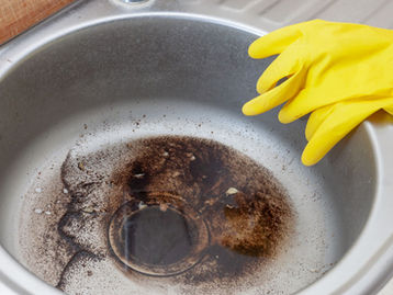 Can I pour tea leaves & coffee grounds down the kitchen sink?