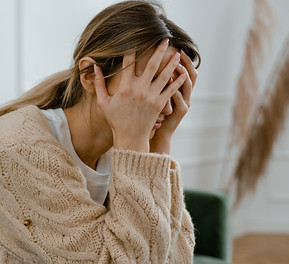 WOMAN HANDS ON FACE pexels-mart-production-7699511.jpg