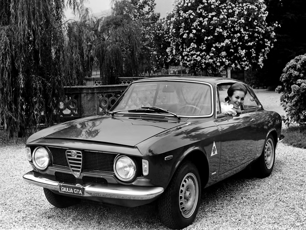 Black‑and‑white vintage photo of Alfa Romeo GTA racing on track – historic motorsport performance