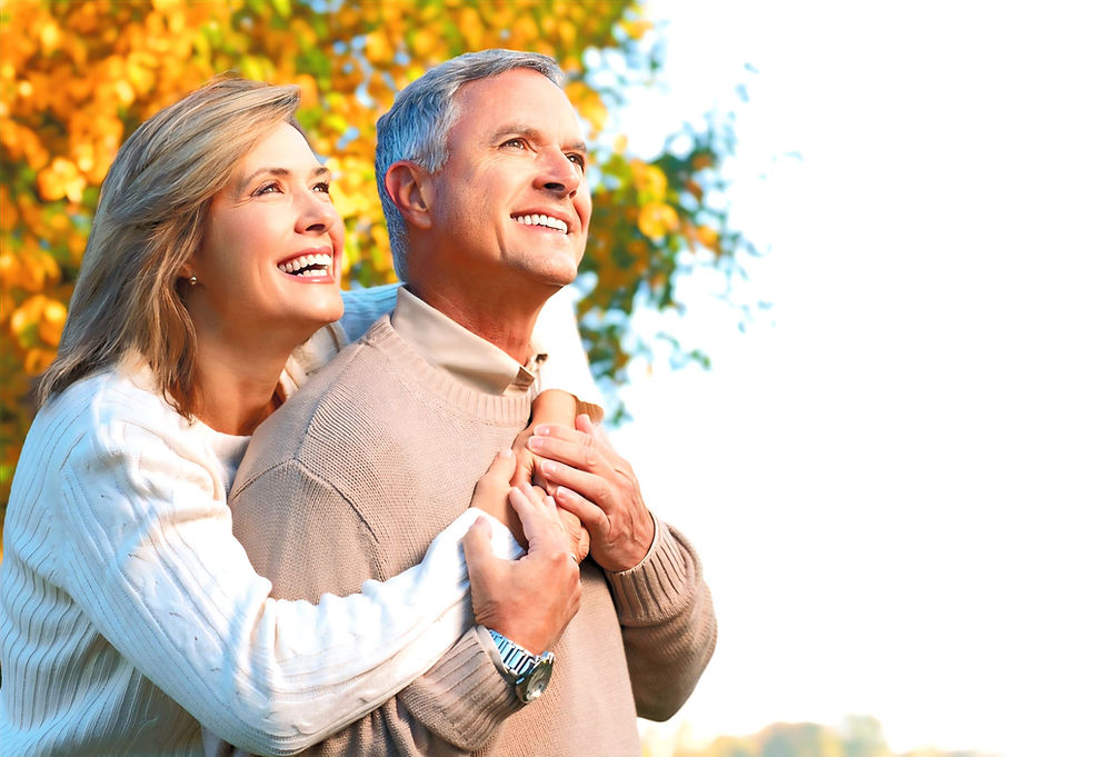 A smiling senior couple embracing outdoors under autumn trees, representing peace of mind and safety. CardiAngel AED offers rapid, reliable support in sudden cardiac arrest situations, making heart-safe living possible for every generation.