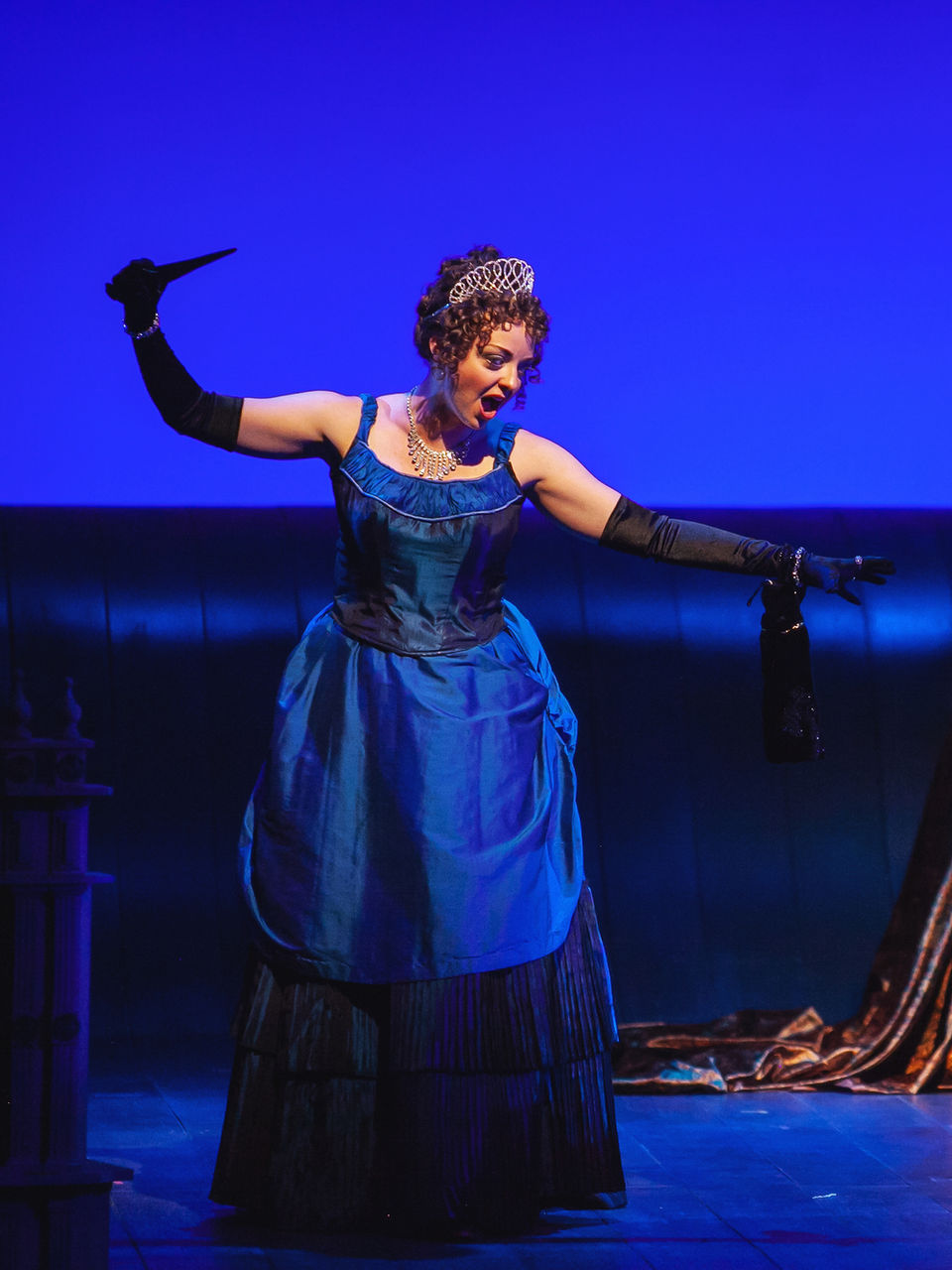Gillian as Queen of the Night in a blue gown points a dagger at Pamina, played by Amanda Austin. Central City Opera, 2018