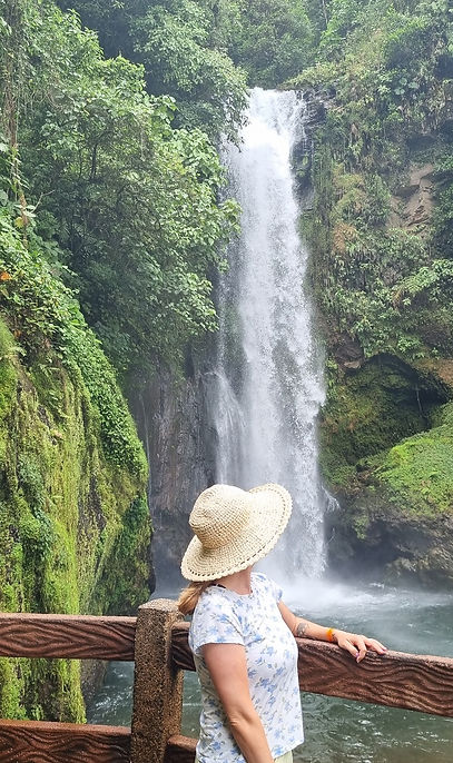 Bronwyn looking at a waterfall.