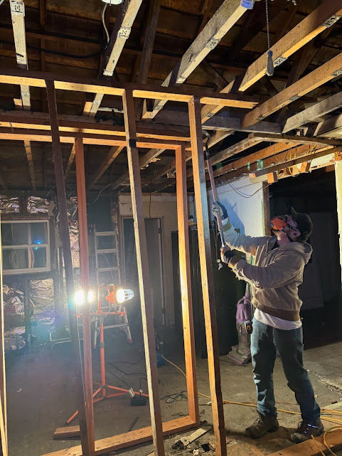 Steve Brown performing a load-bearing wall removal and structural beam installation during a residential remodel in Utah.