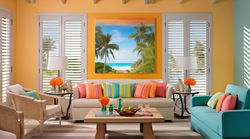 Breezy Florida beach house with louvered shutters high ceilings and bright tropical colors