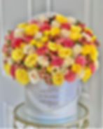 yellow flowers with pink berries