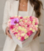 Luxury heart-shaped flower box with pink and white roses and a purple orchid by Le Boutique Royal in Miami.