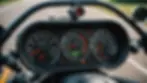 Close-up view of a motorcycle dashboard with gauges