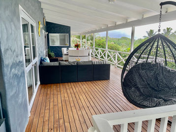 Swing chair in outdoor deck, Muri beach