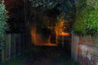 Does this photo show ghosts carrying the body of a witch?