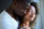 Young couple embracing together at home.jpg